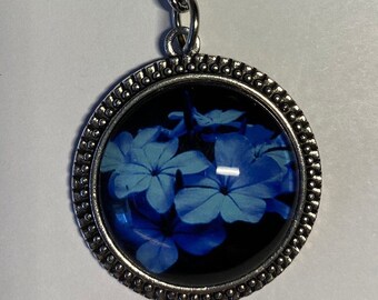 Enclosed Blue Flowers with Dark Backdrop Keychain