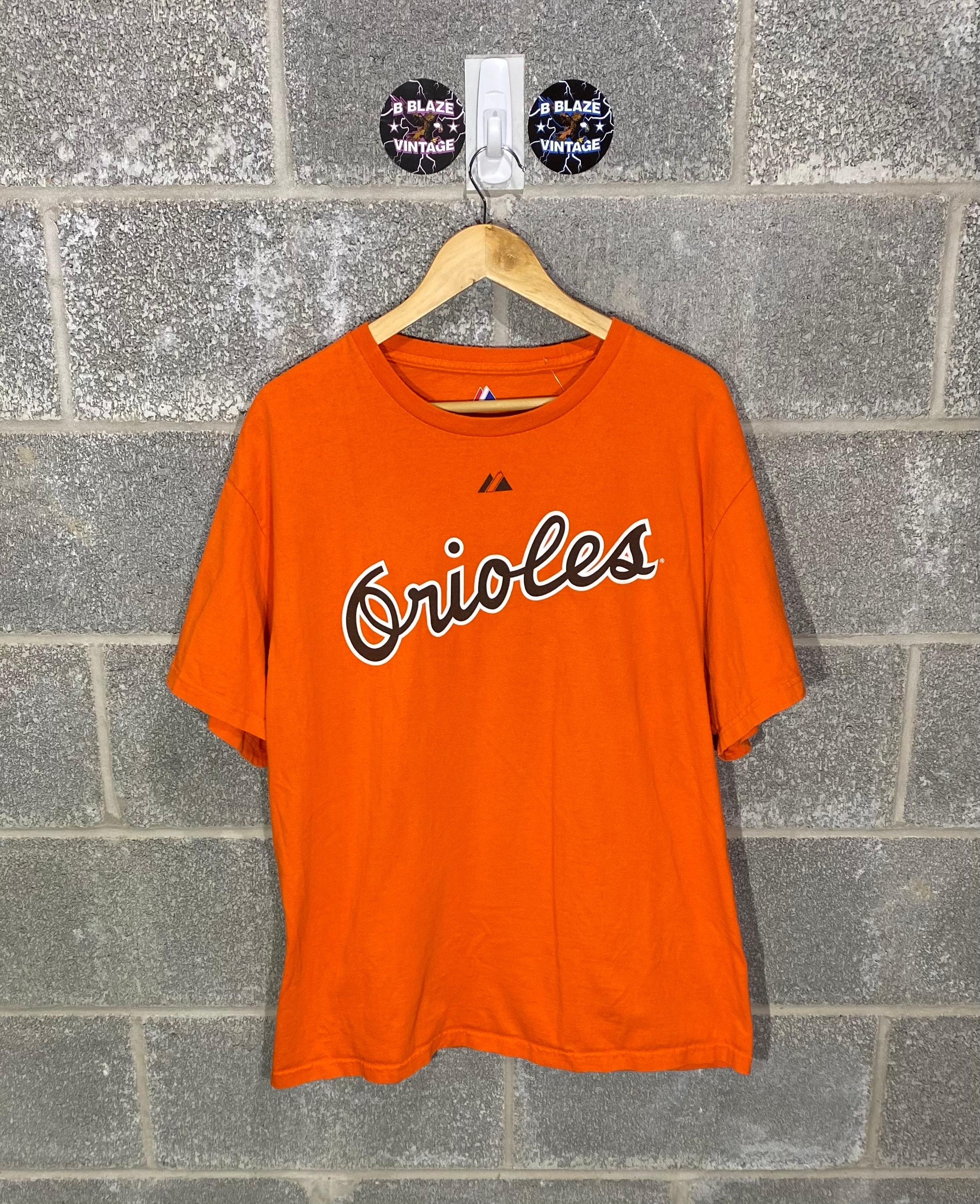 Discover Vintage Y2K 2000s Baltimore Orioles Cal Ripken Jr. Jersey Style Graphic T-Shirt.