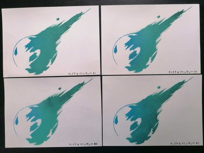 May include: Four white pieces of paper with a green and blue spray-painted image of the Final Fantasy VII logo. The text "ファイナルファンタジー VII" is written in Japanese at the bottom of each piece of paper.