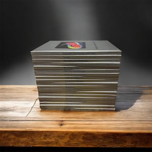 May include: A stack of seventeen silver-covered books from the Understanding Computers series by Time-Life Books. Each spine features the series title, a specific volume topic such as Robotics or Artificial Intelligence, and the publisher name.
