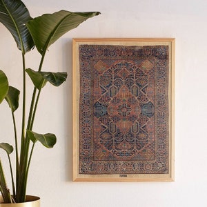 May include: A framed print of a vintage rug with intricate patterns in shades of red, blue, and beige. The rug is surrounded by a wooden frame and the word "Isfahan" is printed in the bottom right corner.