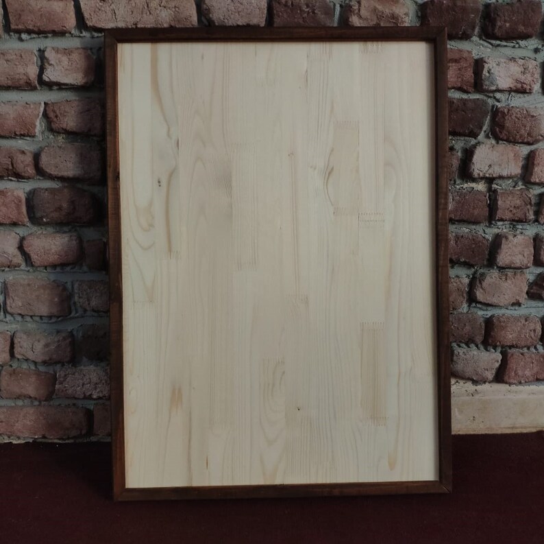 May include: A plain wooden sign with a dark brown frame. The sign is blank and ready to be customized.