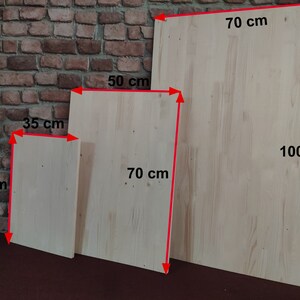 May include: Three wooden boards of different sizes. The largest board is 70 inches by 100 inches. The middle board is 50 inches by 70 inches. The smallest board is 35 inches by 50 inches.