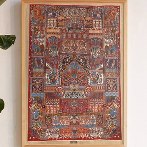 May include: A framed print of a colorful, intricate rug with a geometric design. The rug is red, blue, green, and yellow. The frame is made of wood and has a natural finish. The print is titled "Isfiba".
