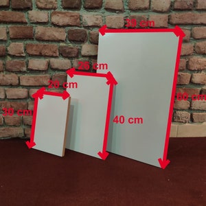 May include: Three white canvases of different sizes. The largest canvas measures 39 inches by 60 inches, the middle canvas measures 26 inches by 40 inches, and the smallest canvas measures 20 inches by 30 inches.