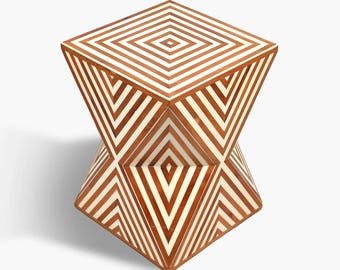 May include: A geometric side table with a diamond pattern. The table is made of wood and features a repeating pattern of brown and white stripes. The table has a unique, inverted pyramid shape.