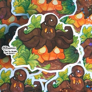 May include: A sticker featuring a brown octopus with a curled tentacle on top of its head, sitting on top of an orange pumpkin with green leaves. The sticker has a white border and the text "@Zuccini Don't Re-Upload My Content!" in black.