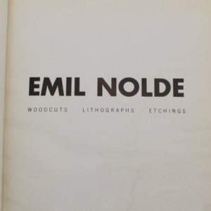 May include: A black and white poster advertising an exhibition of Emil Nolde's woodcuts, lithographs, and etchings at the Allan Frumkin Gallery in Chicago, Illinois. The poster is dated December 1969.