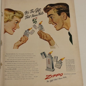 May include: A vintage advertisement for Zippo lighters featuring a couple exchanging gifts. The ad copy reads "It's The Gift That Never Fails" and highlights the lifetime guarantee of Zippo lighters. The ad also mentions that Zippo lighters can be engraved with a personal message.