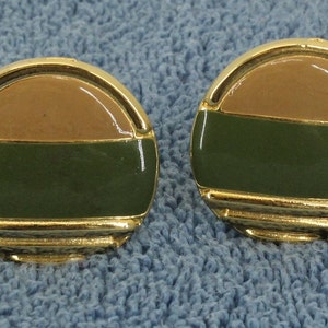 Clamp on style earrings. Brown and Green inlayed Lucite 1 1/4&quot; diameter