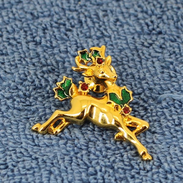 Vintage Avon Christmas Gold Tone Reindeer Pin Brooch with Green Holly leaves and Red Rhinestones berries