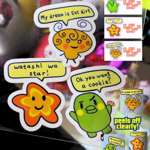 May include: A set of eight colorful stickers featuring cartoon characters and text. The stickers are printed on clear vinyl and have a glossy finish. The stickers are 1.5 inches by 1.7 inches and 1.5 inches by 1.5 inches. The stickers are perfect for adding a touch of whimsy to laptops, water bottles, notebooks, and more.