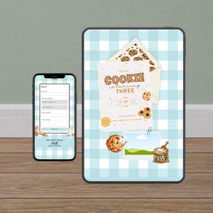 May include: A smartphone and tablet display a birthday invitation with a cookie theme. The invitation reads "Our Little Cookie is turning Three" with a date and RSVP details. The background is a light blue gingham pattern.