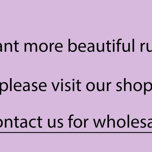 May include: Text on a purple background that reads: "Want more beautiful rugs please visit our shop Contact us for wholesale"