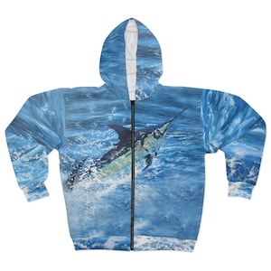 May include: A blue zip-up hoodie with a full-color print of a marlin jumping out of the water.
