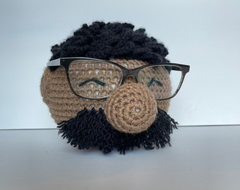 Crochet man glasses holder.