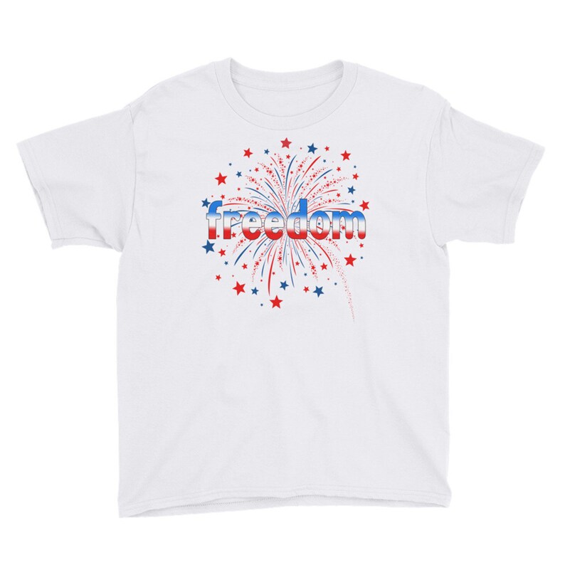 May include: White youth t-shirt with a red, white, and blue firework graphic and the word "freedom" in a silver font.