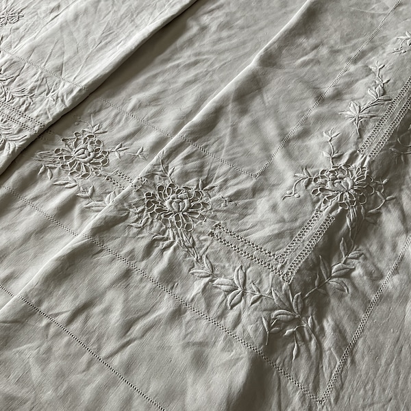 Beautiful embroidered and cutwork over the full width of this antique fil de lin sheet