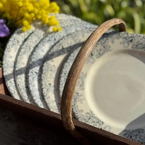 May include: A set of three ceramic mugs with a speckled, matte finish in cream, light grey, and dark grey. Each mug has a simple, minimalist design, suitable for coffee or tea.