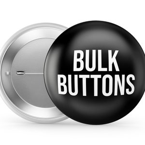 May include: A black button with white text that reads "BULK BUTTONS". The button is attached to a silver metal backing.