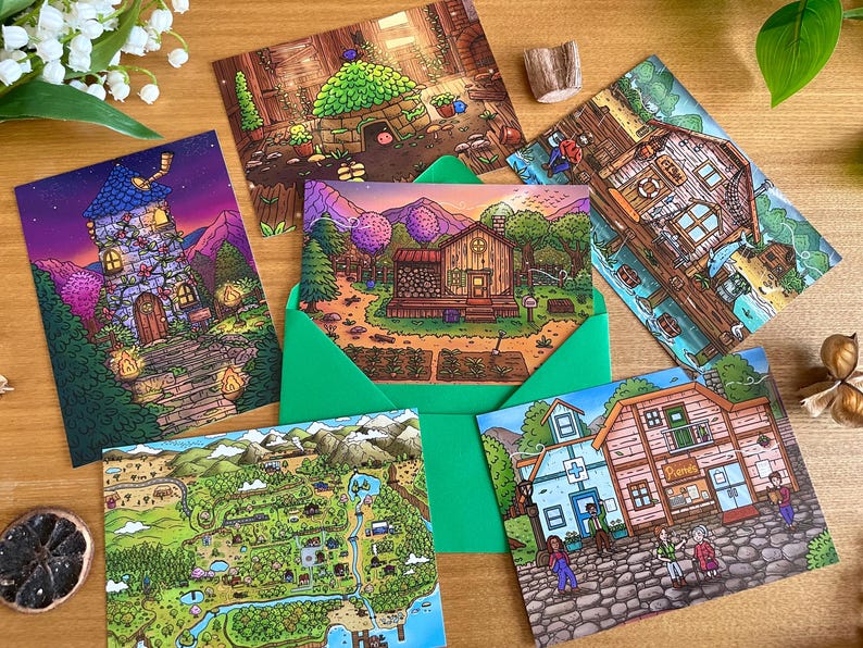 May include: A collection of illustrated postcards featuring whimsical scenes. The cards depict various settings, including a detailed map, a cozy cottage, and a fantastical tower. The cards are arranged with a green envelope and decorative elements.