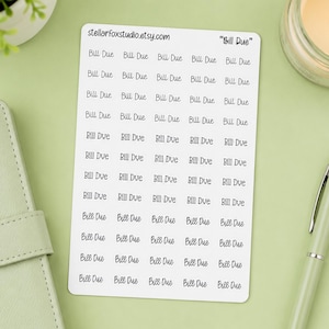 May include: A white rectangular sticker sheet featuring multiple rows of the text Bill Due in a black cursive font. The top of the sheet includes the text stellarfoxstudio.etsy.com and the title Bill Due in quotes, printed in black ink.