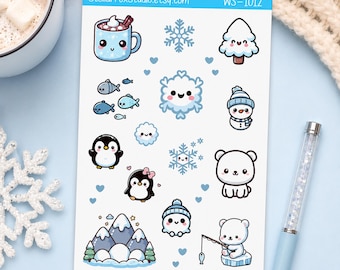 May include: A sticker sheet labeled StellarFoxStudio.etsy.com WS-1012 featuring various winter-themed illustrations including a mug of cocoa, snowflakes, a pine tree, fish, a snowman, penguins, a polar bear, and snowy mountains.