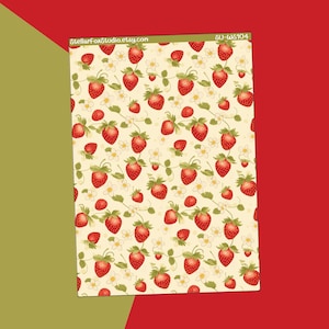 May include: A sheet of paper with a repeating pattern of red strawberries, green leaves, and white flowers on a cream background. The text "StellarFoxStudio.etsy.com" is visible. The paper is labeled "SO-WS104".