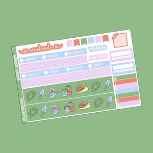 May include: A planner sticker sheet with a green background. The stickers have a gardening theme, with illustrations of plants, snails, and gardening tools. The text includes days of the week and the words "weekend", "this week", and "next week".