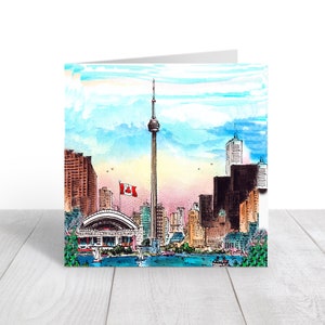 May include: A watercolor painting of the Toronto skyline, featuring the CN Tower, other skyscrapers, and a waterfront scene. The Canadian flag is flying from the top of the CN Tower.
