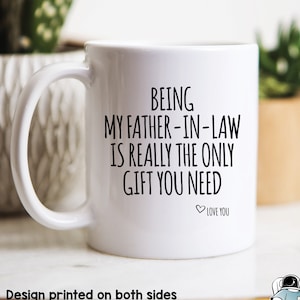 May include: White ceramic coffee mug with black text that reads "Being my father-in-law is really the only gift you need. Love you".