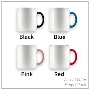 May include: Four 11-ounce white ceramic mugs with colored accents around the rim and handle. The mugs are arranged in two rows of two. The top row shows a black accent mug and a blue accent mug. The bottom row shows a pink accent mug and a red accent mug. Accent Color Mugs (11 oz)
