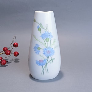 Vintage white porcelain vase with hand painted blue flowers