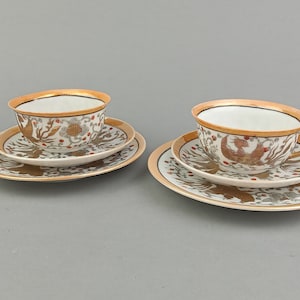 Set of two vintage porcelain coffee cup, saucer and dessert plate from China