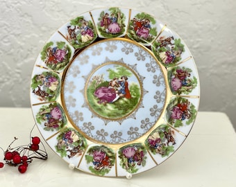 Assiette rétro antique du 20ème siècle avec un beau décor