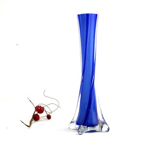 Vintage vase made of glass with internal blue and white coating.