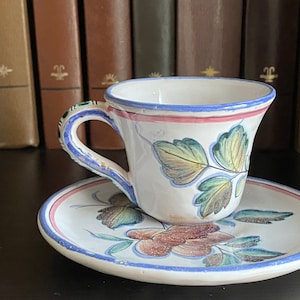 Small porcelain coffee cup with saucer.  Hand painted floral decor, Portugal