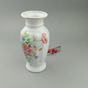 Vintage vase made of white porcelain with nice floral decal. Made in China