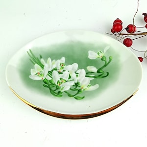 White porcelain small serving plate with hand-drawn floral ornament