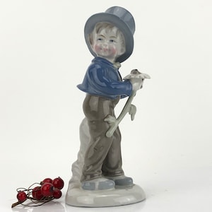 Vintage fine porcelain figurine boy with a flower by Wagner & Apel, GDR