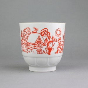 Porcelain vintage childrens white cup with red pattern with fairy tale character