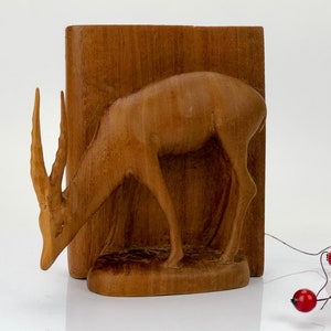 Antique deer figurine hand made carved from a single piece of wood