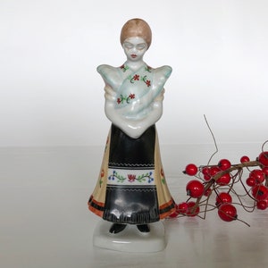 Girl figurine made in Hungary from Porcelain by Hollohaza, Hungary in the 20th century