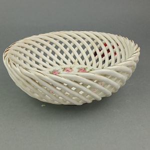 Vintage lattice bowl for fruits with the rose