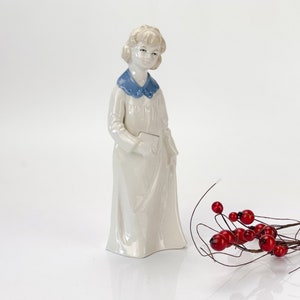 Vintage porcelain Girl figurine by Wagner and Apel porcelain factory. Made in 20th century GDR (East Germany)