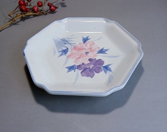 Vintage faience plate with hand-painted floral motif