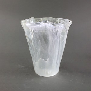 Vintage flower vase made of translucent glass