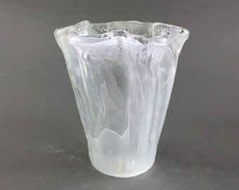 Vintage flower vase made of translucent glass