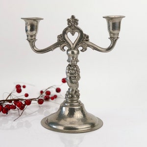Vintage pewter candlestick for two candles. Made in Europe