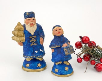 A pair of festive decorative vintage ceramic figurines for Christmas and New Year themes